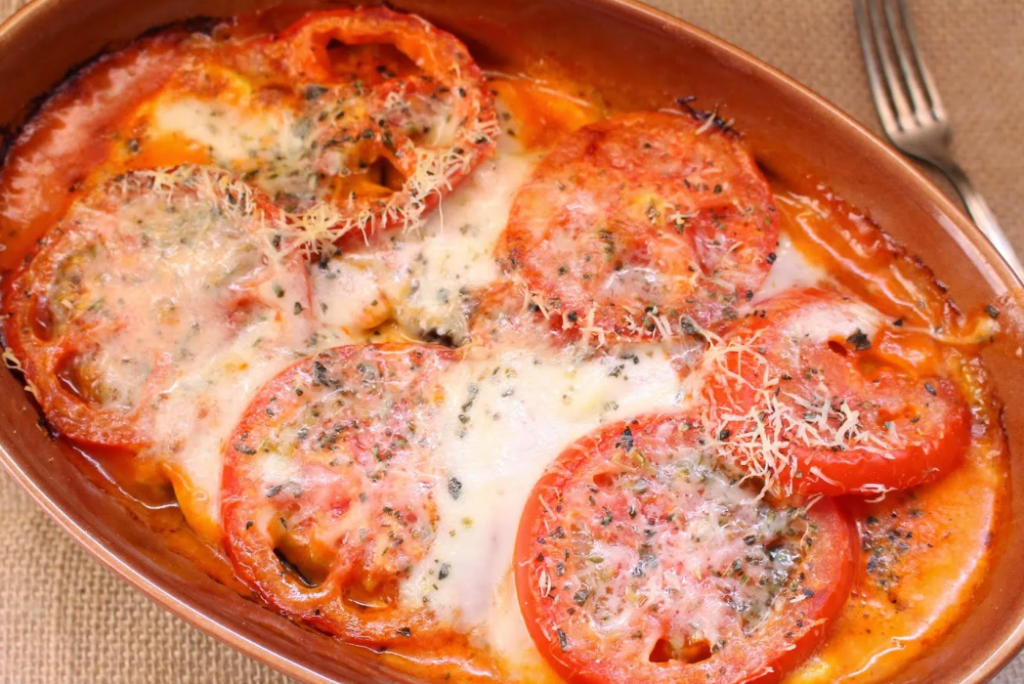Filete de merluza al horno con calabacín y tomate
